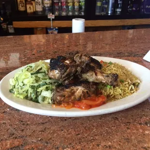 Delicious Jerk chicken plate at Phil's bar
