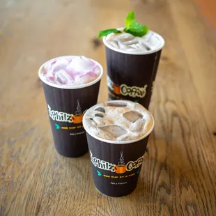 three cups of coffee on a table