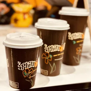 three cups of coffee on a tray