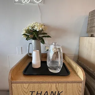 Not sure if the self serve water pitch and cups should be on top of the trash bin