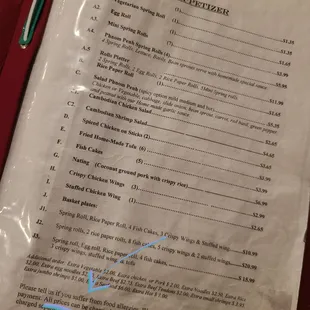 The fine print on the outdated menu from 2015.