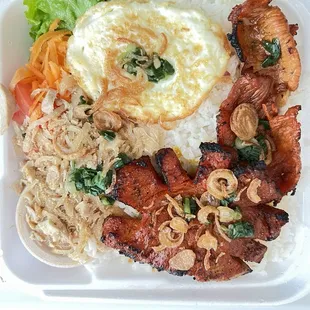 Rice with pork chop, fried egg and pork