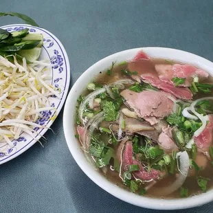 Phö with brisket and filet mignon, notice the huge helping of basil, springs, and lime!