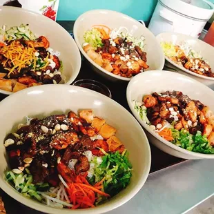 four bowls of food on a table