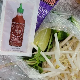 a packet of ketchup and some vegetables