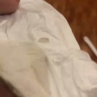 a person cutting a piece of paper