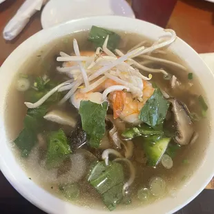 Chicken broth with shrimp, chicken and mushrooms added