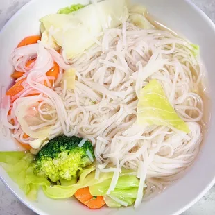 a bowl of noodles and vegetables