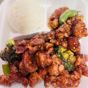 chicken and broccoli with rice in a styrofoam container