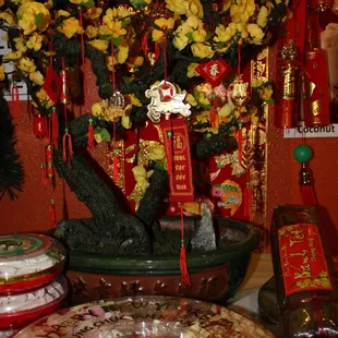 We celebrated Vietnamese New Year with on 1/31/14, with traditional flower deco, fruit candies, firecrackers, Lion Dance video