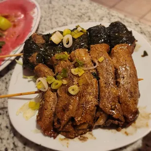 a plate of meat and vegetables