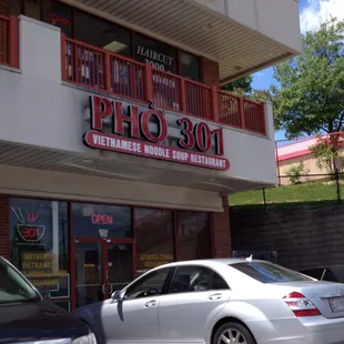 cars parked in front of the restaurant