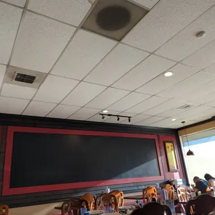 a restaurant with a large screen