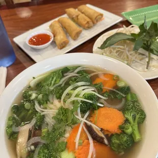 Vegetable and fried tofu pho with egg rolls