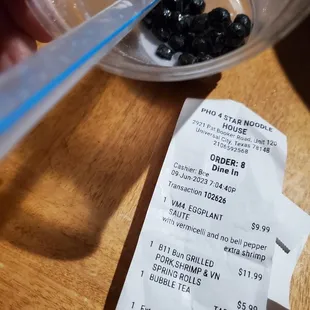 The tab for Pho Four Star Restaurant, with a picture of a badly made Bubble Tea..