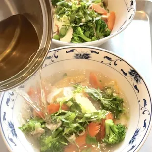 Vegetarian Pho with tofu, broccoli, carrot, mushroom in vegetarian broth.