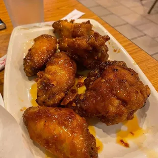 a plate of fried chicken wings