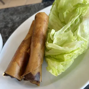 a plate of food with lettuce