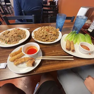 Noodles and fried rice with fried shrimp appetizers and egg roll