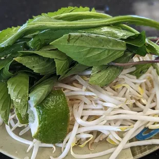 a plate of sprouts and greens