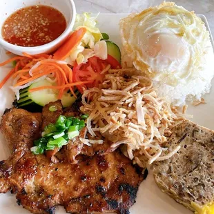 Broken rice with pork chop, egg, shredded pork skin, and vietnamese meatloaf.