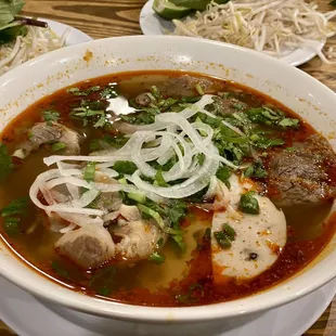 a bowl of soup with meat and vegetables