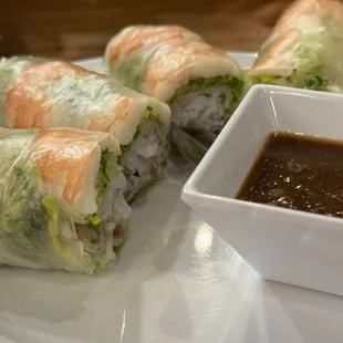 a plate of food with dipping sauce