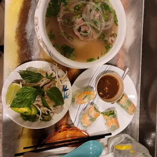 Rare steak and brisket pho. - Sprouts, basil, jalepenos, lime Shrimp and pork spring roll.