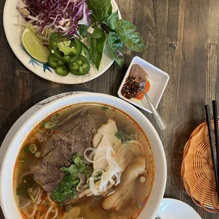 a bowl of soup and a plate of salad