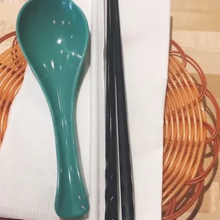 chopsticks and a bowl of noodles