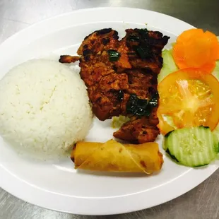 Rice chicken with a egg roll. Yummy
