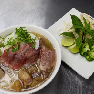 a bowl of soup and a plate of vegetables