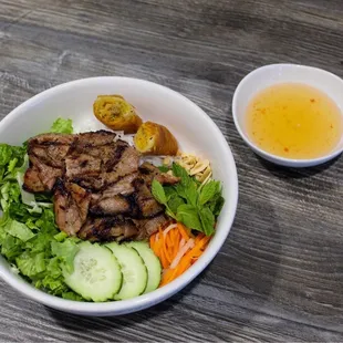 a bowl of food and a drink