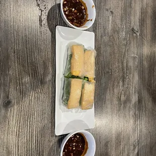 two plates of food on a wooden table