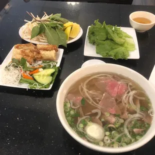 a bowl of soup and a plate of salad