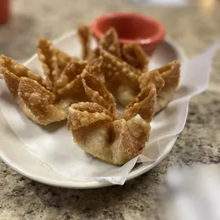 a plate of wontons on a table