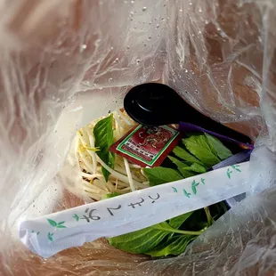 Garnish and condiments bag completely soaked the paper chopsticks cover.