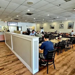 The view as you enter the dining room. The cash register is on the left. The restrooms are on the right at the back of the dining room.