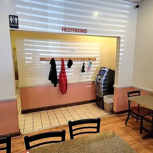 ATM machine, coat hangers, and restrooms.