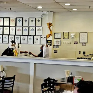 The counter where you pay, get carryout, and get containers for leftovers.