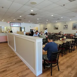 Dining room. Cashier located at the end of the half wall.