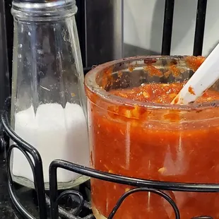 Zoom in an look at the nasty grime on the condiment holder, the nasty salt shaker, and the crusty old chili sauce.