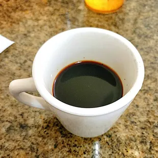 The coffee before it was stirred. Very thick and dark. There is sweet condensed milk at the bottom of this mug.
