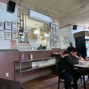 two people sitting at a table in a restaurant
