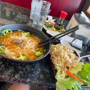 a bowl of soup and a plate of salad