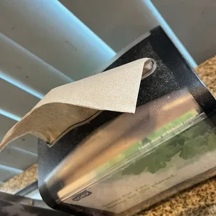 Dirty napkin dispenser (dust?)