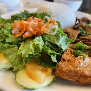 BBQ beef plate with rice, pickled vegetables, fried shrimp patty