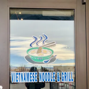 a vietnamese noodle and grill sign