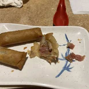 Pork eggrolls.  Raw meat inside.  Not a good look.  Not even an apology...must happen often. ‍