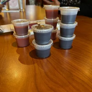 four cups of soup on a table